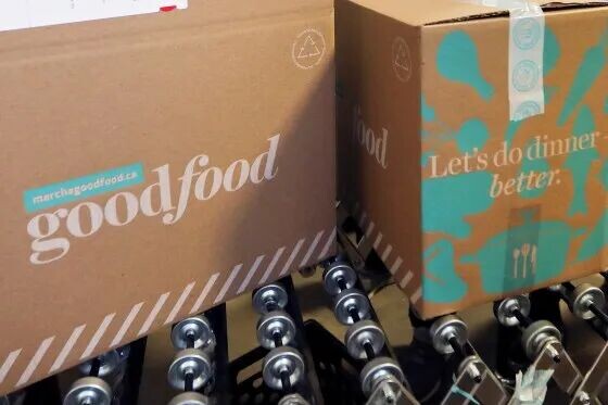 Goodfood boxes on a conveyor belt.